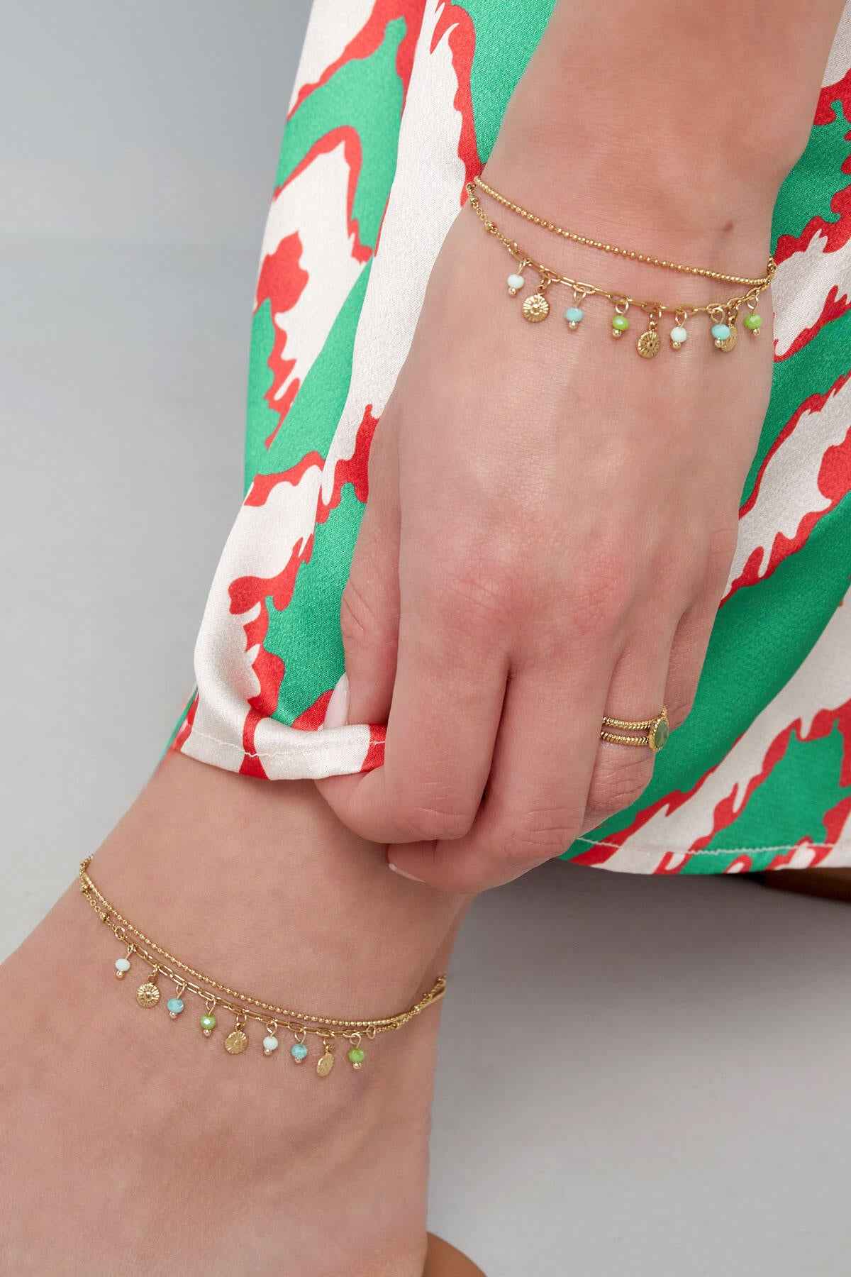 Armband met muntjes en kralen - roze/Goud kleur