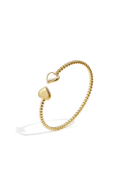 Symmetrisch gestipte bangle met gedetailleerde uiteinden