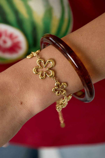 Armband met koraalvormige speelse bloemen in variërende maten