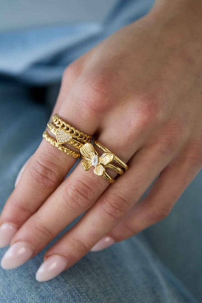 Gelaagde statement ring met bloem en steen