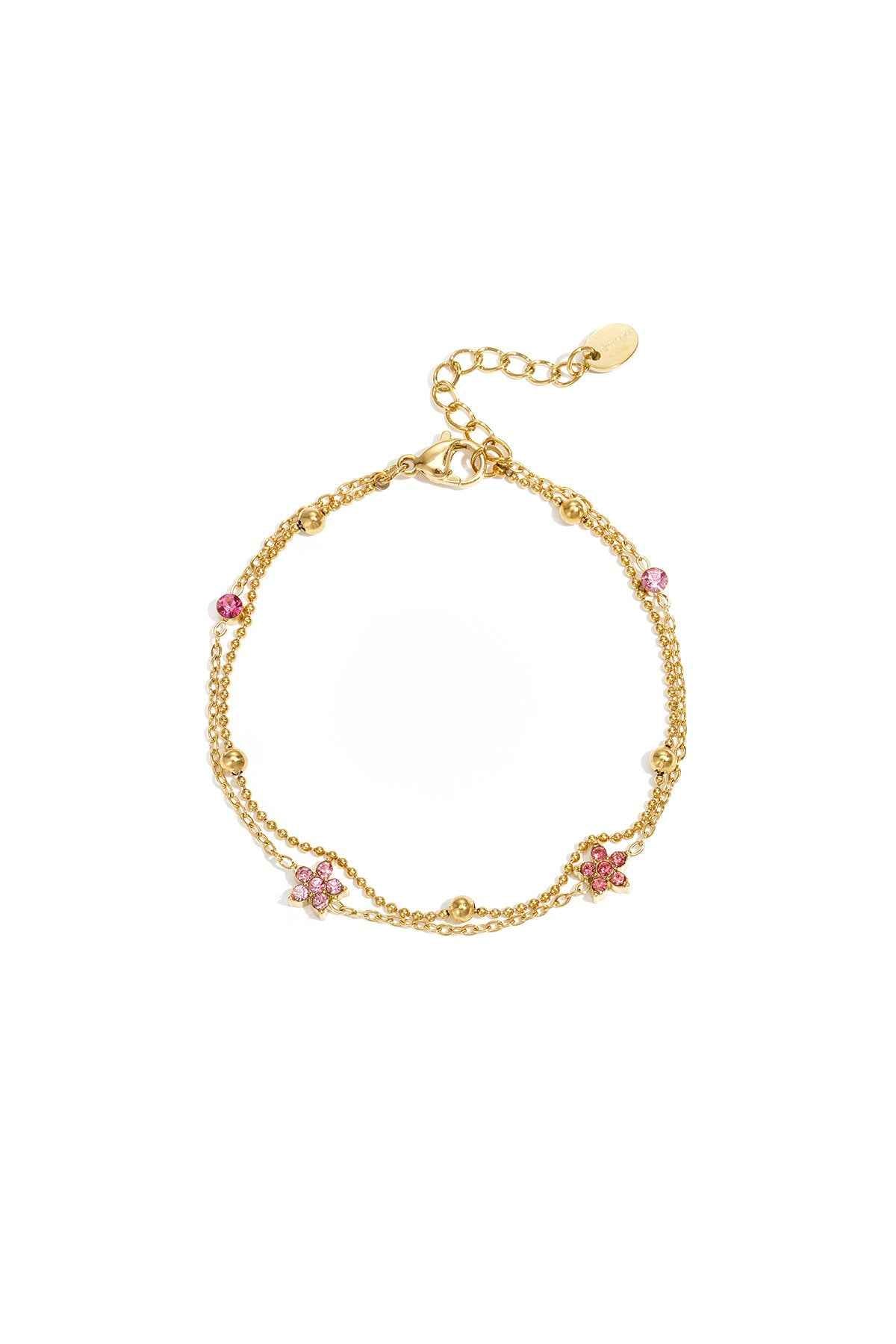 Armband met gekleurde steentjes belegde bloemetjes