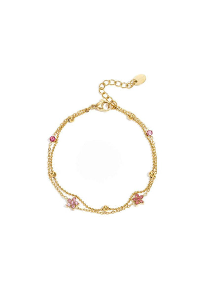 Armband met gekleurde steentjes belegde bloemetjes