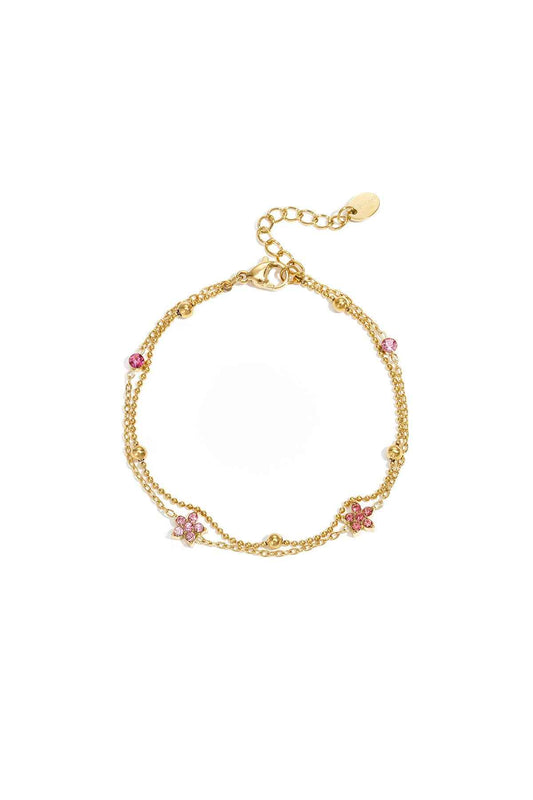 Armband met gekleurde steentjes belegde bloemetjes