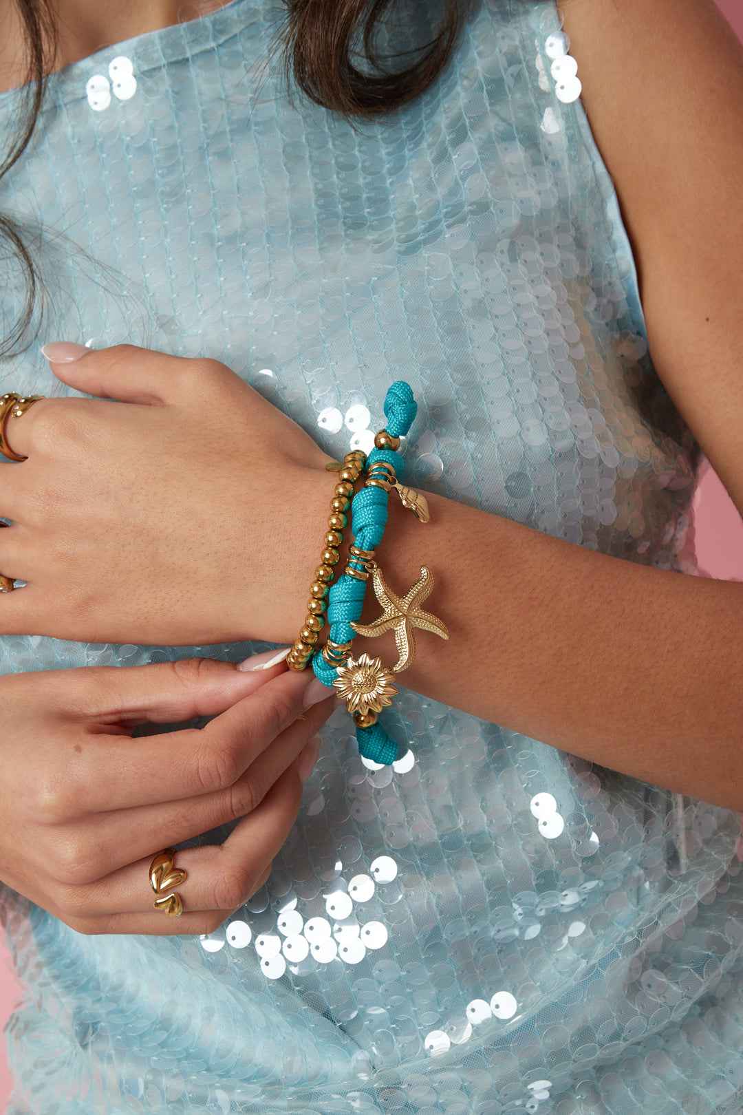 Rope bracelet with knots and various charms