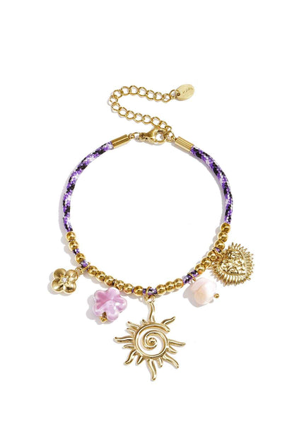Colorful cord bracelet with varying pendants purple