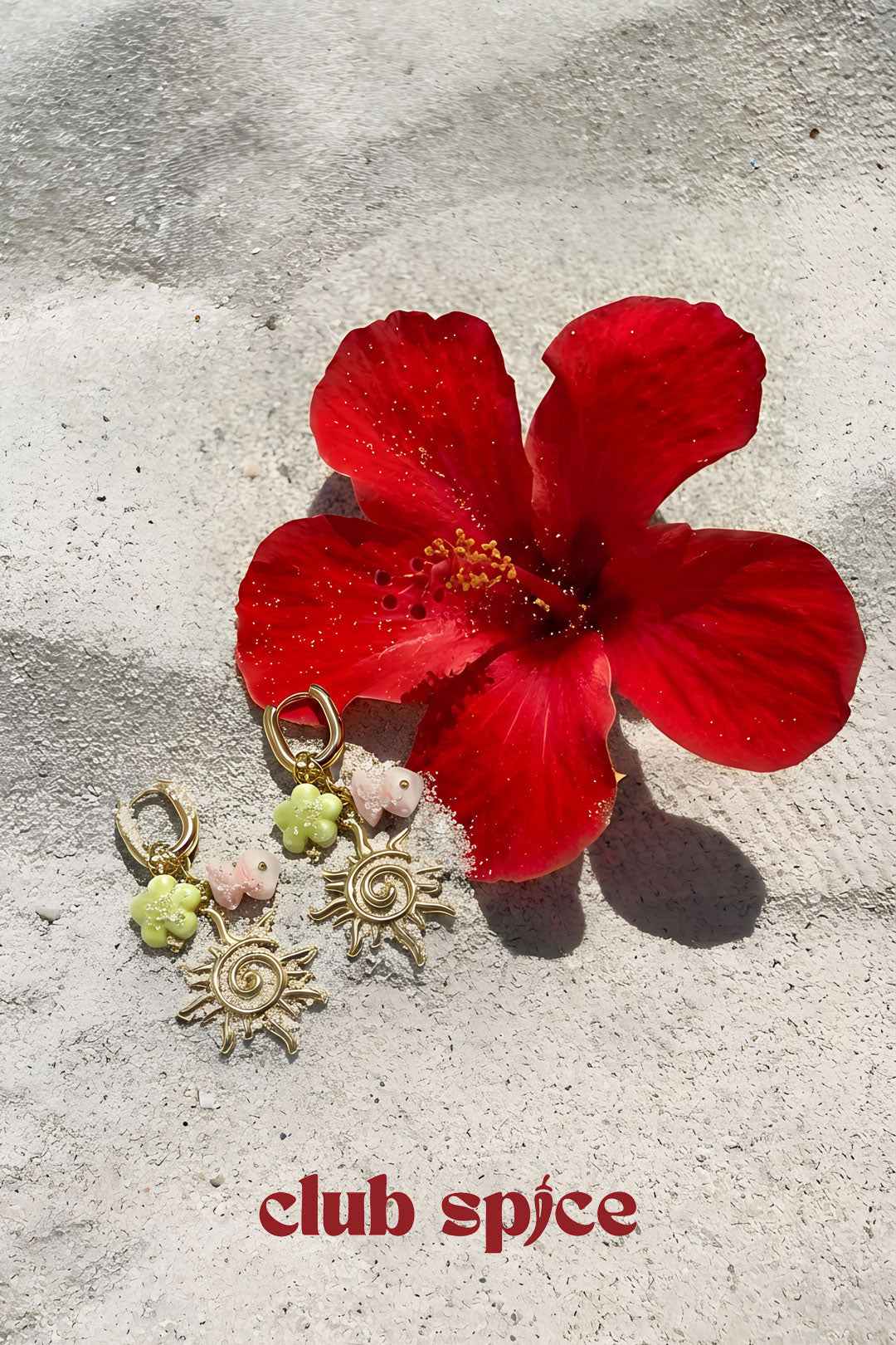 Oval hoop earrings with sun and bead charms