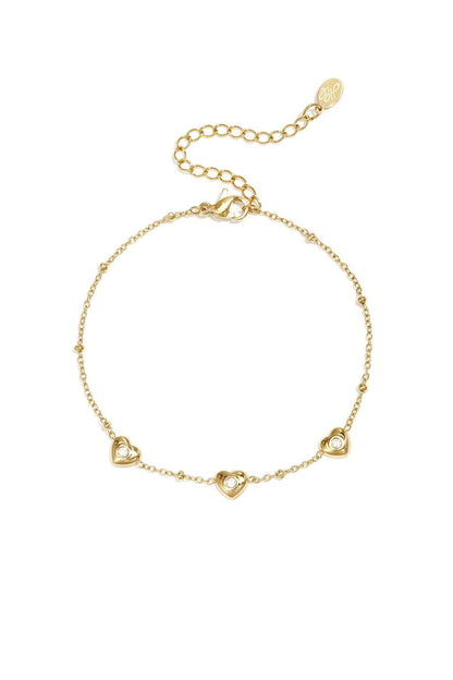 Armband met bolletjes en hartjes met steen