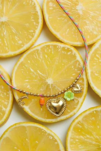 Colorful cord necklace with varying pendants