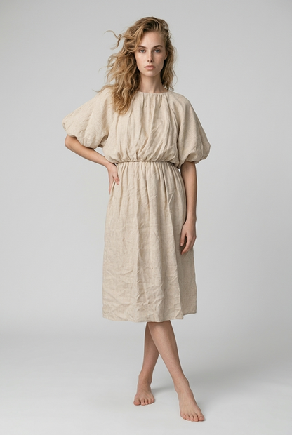 Beige jurk met ballonmouwen