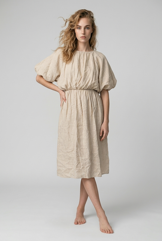 Beige jurk met ballonmouwen