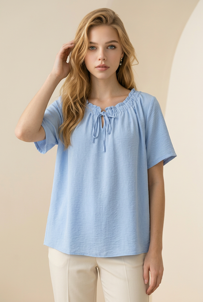 Lichtblauwe blouse top met strikdetail