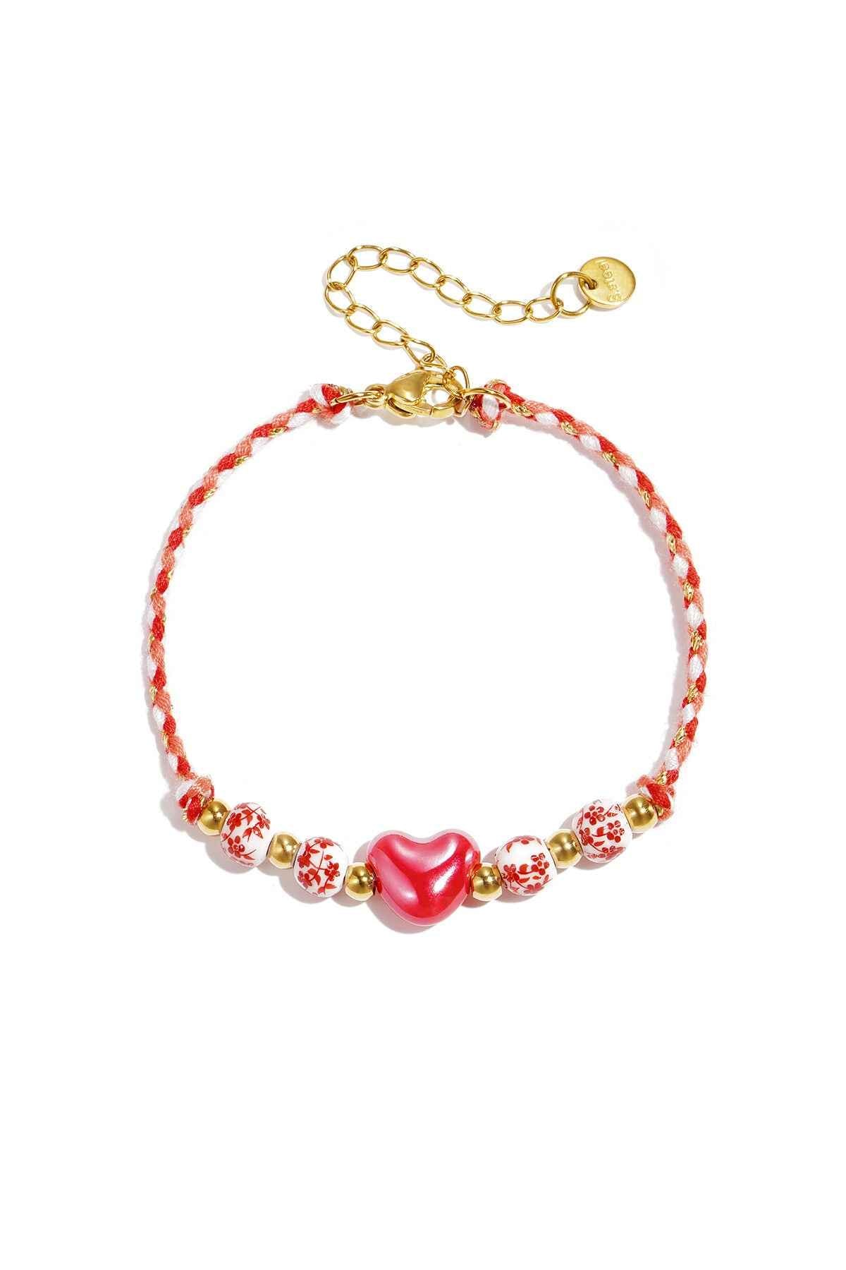Gevlochten armband met kralen met design en hart