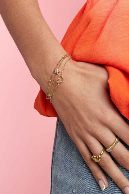 Armband met gekleurde steentjes belegde bloemetjes
