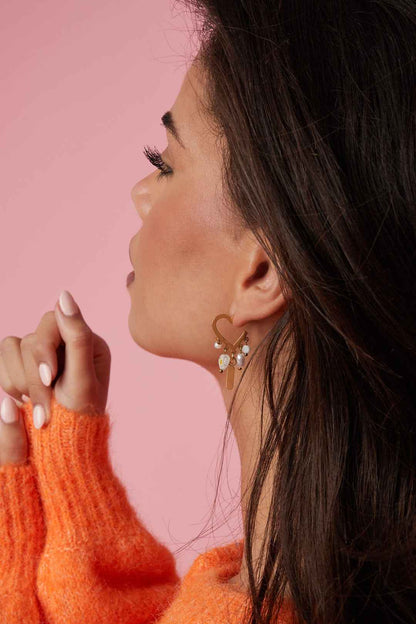 Heart-shaped earrings with hanging beads and charms
