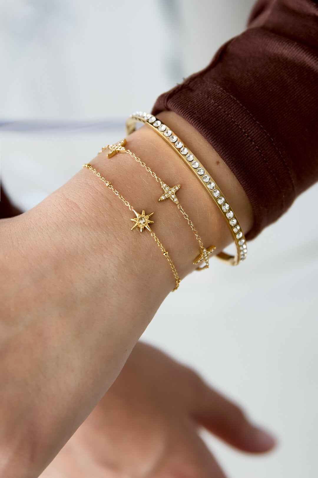 Armband met klavermotief en belegde klavers