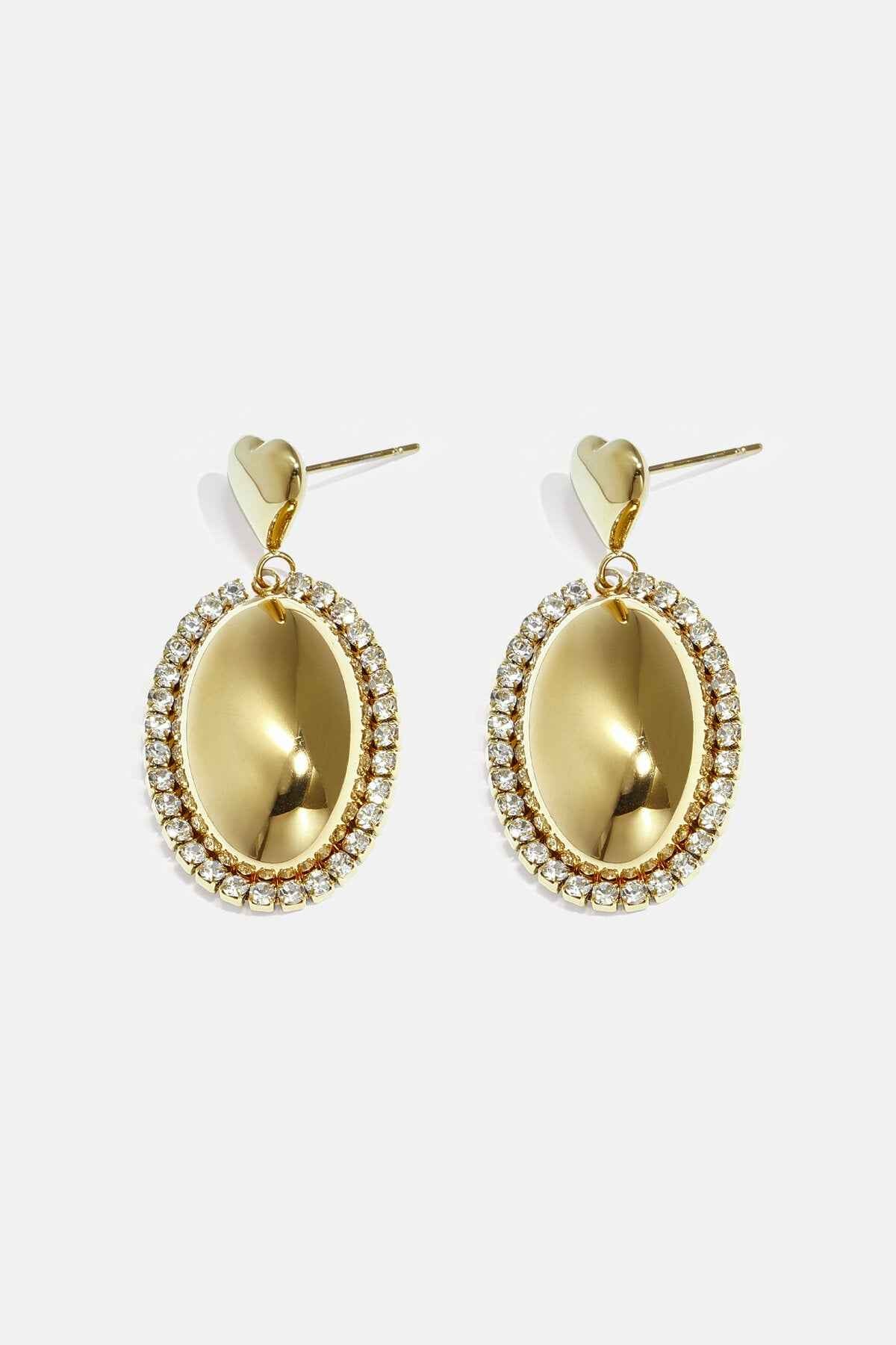 Statement oorbellen met ovale charm omringd met steentjes