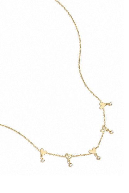 Ketting met wisselende hartjes en hangende steentjes
