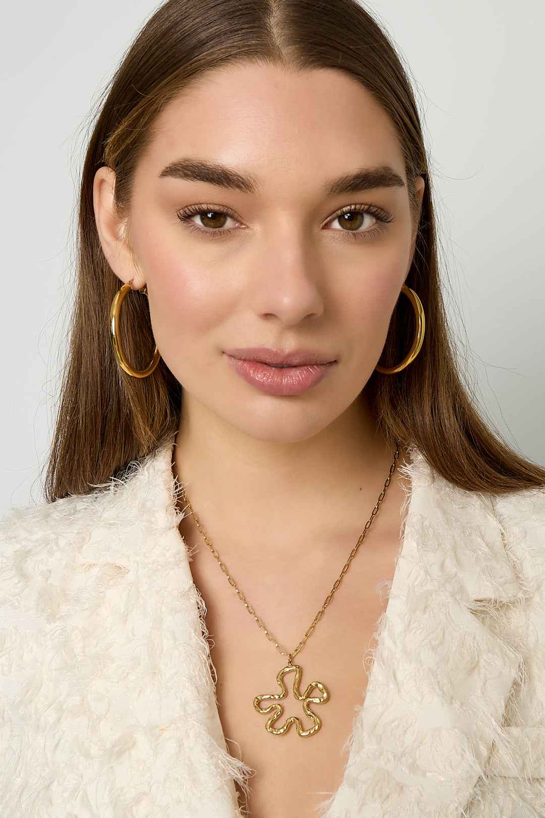 Necklace with hanging flower charm